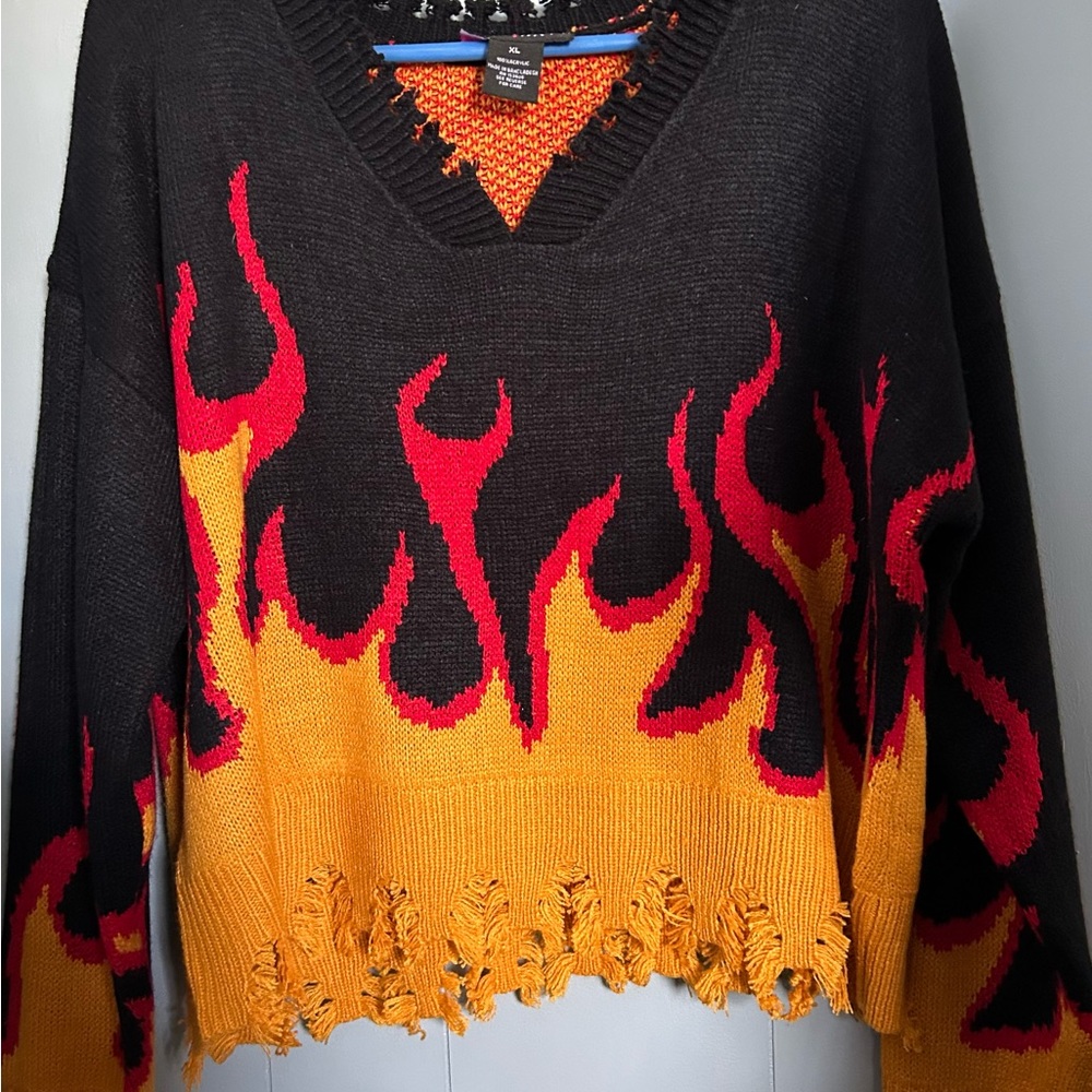 Vibrant Black and Red V-Neck Sweater with Flame Design